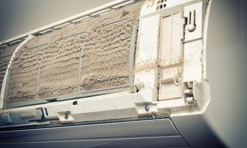 Dirty air condition Closeup view of an open Air condition unit and very dirty air filters.